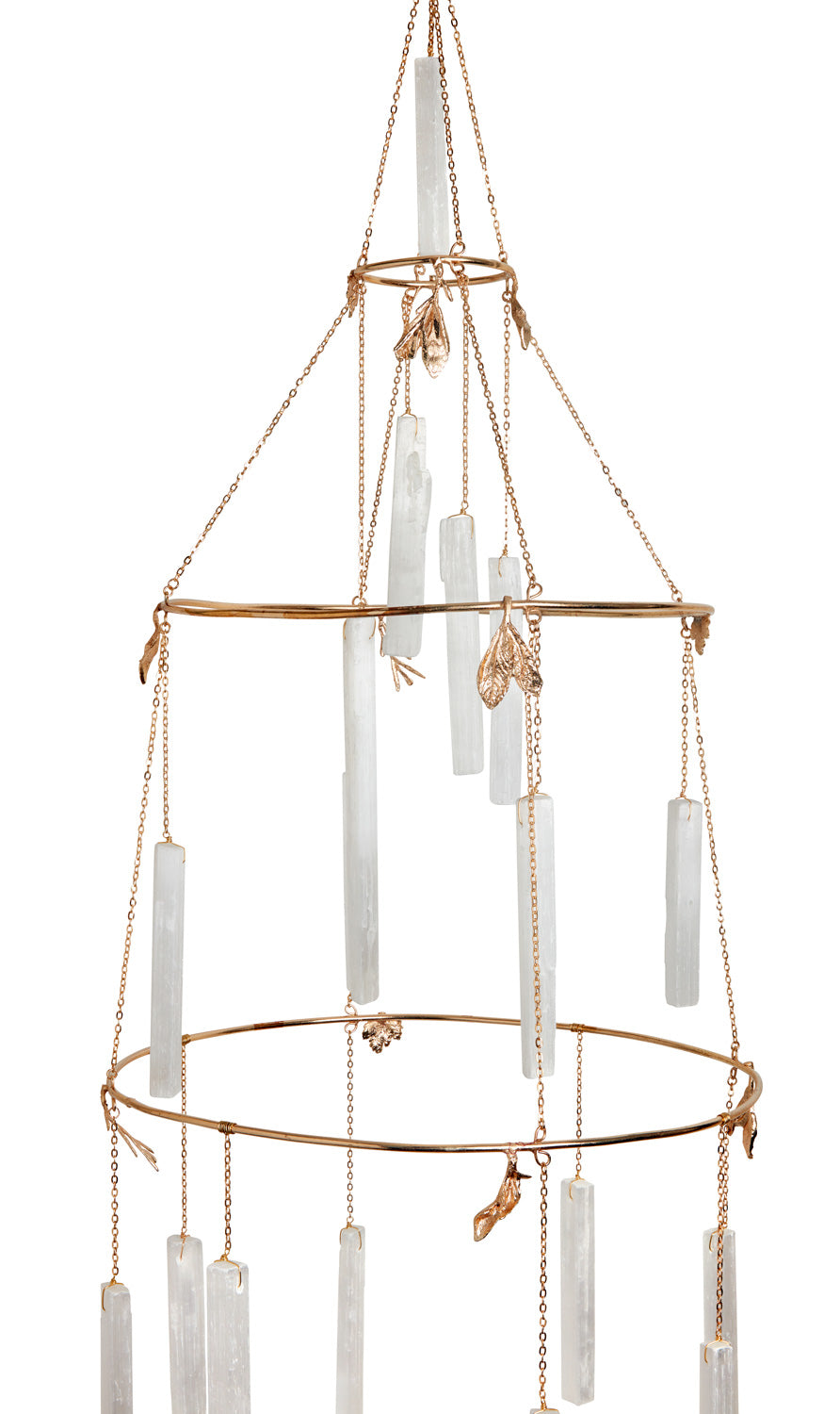 Close-up of the Selenite Crystal Chandelier's gilded rings and golden leaf charms among the selenite logs - Ariana Ost