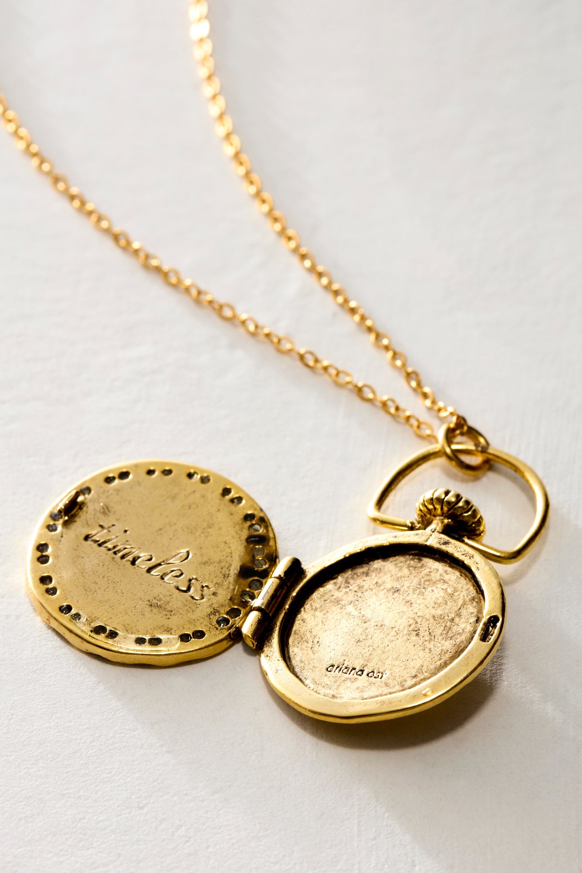 Clock Locket open, showing timeless engraved inside the lid - Ariana Ost