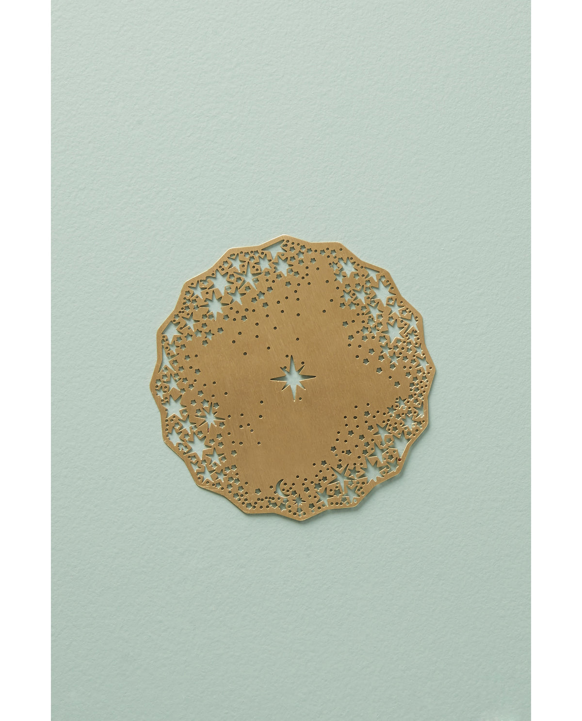 Gold Celestial Coaster on a sage table - Ariana Ost