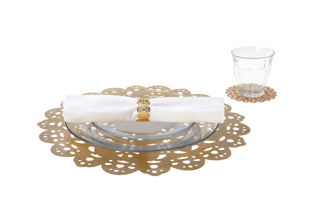 Gold eyelet doily place setting with the Eyelet Charger under a plate, eyelet napkin ring and Eyelet Doily Coaster - Ariana Ost
