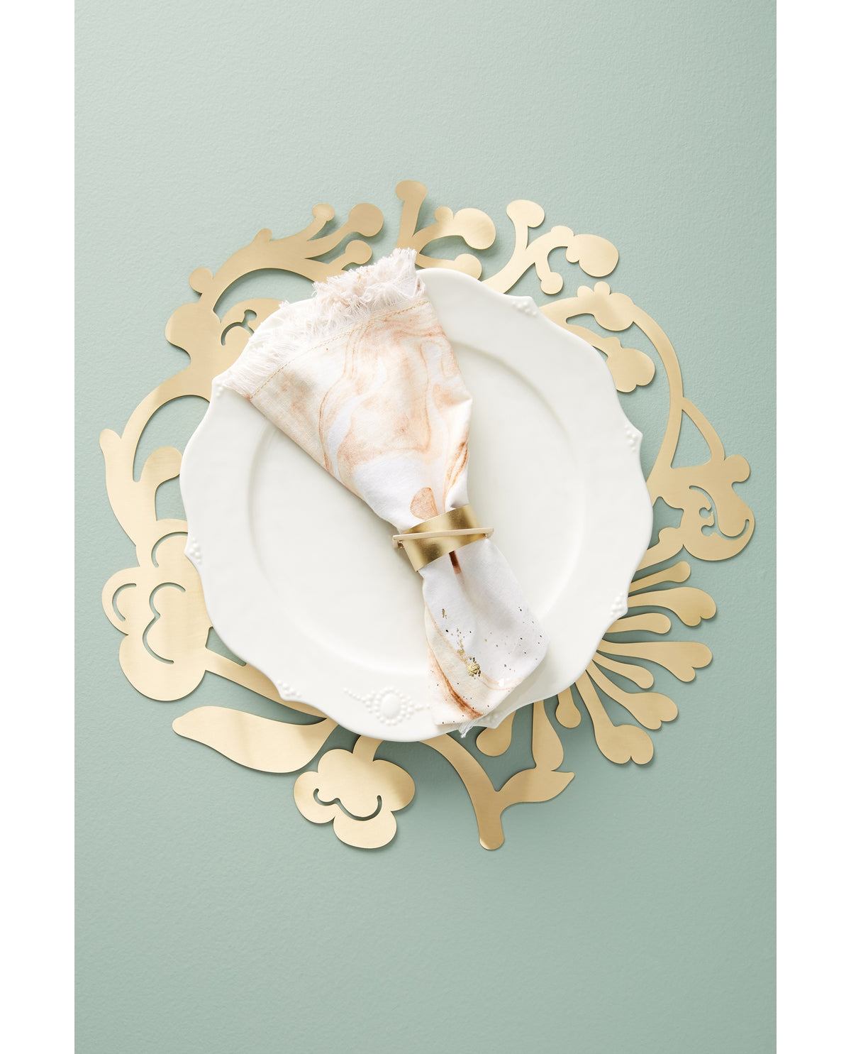 Floral Wreath Charger under a white plate with the Floral Wreath Napkin Ring - Ariana Ost