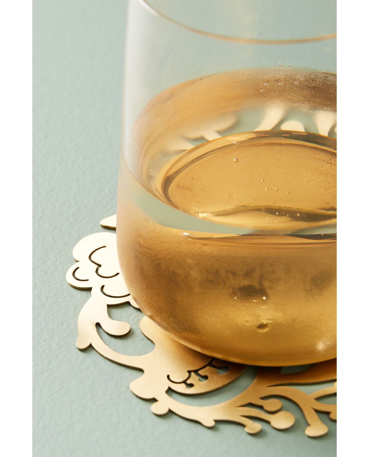 Gold Floral Wreath Coaster under a glass - Ariana Ost